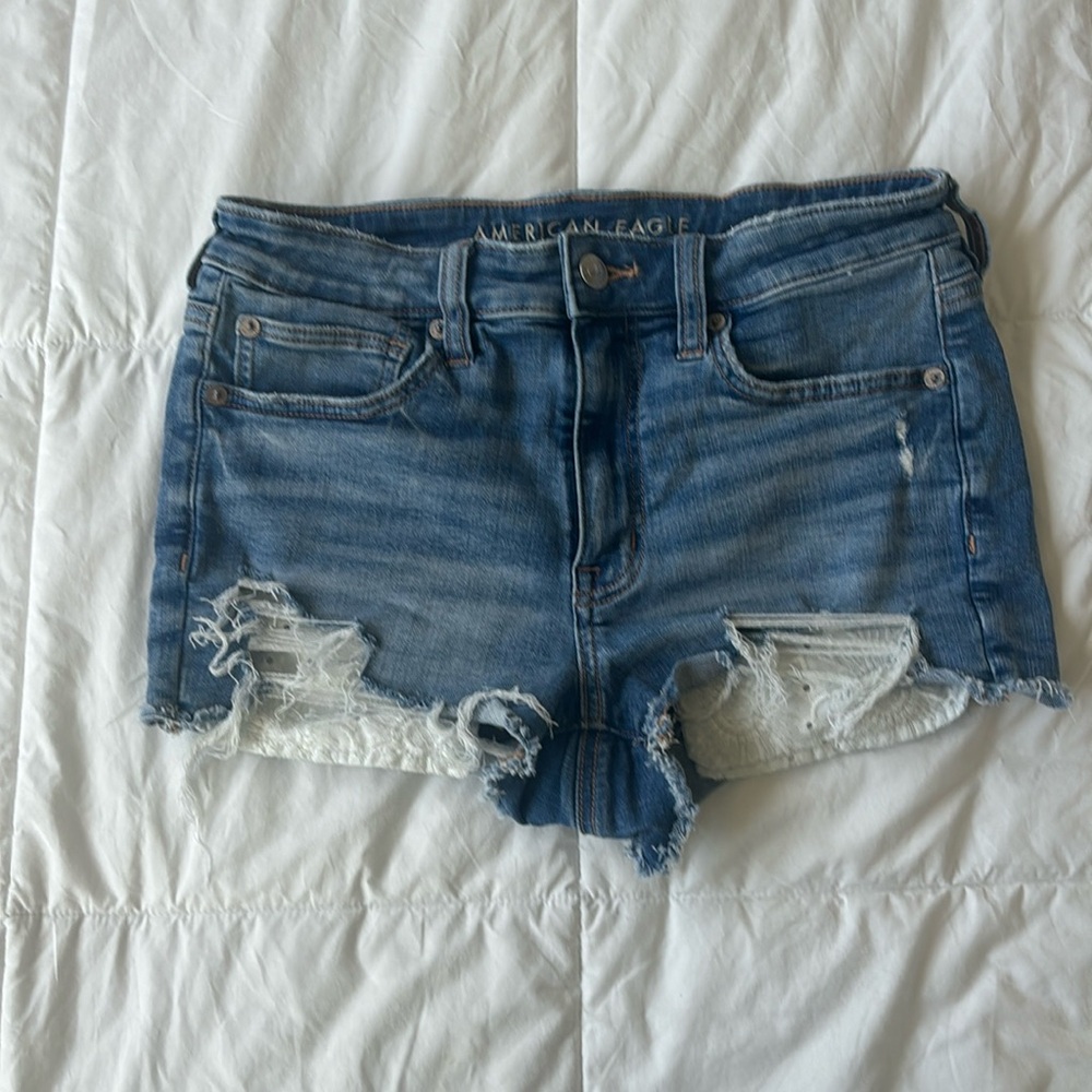 American Eagle Jean Shorts with white flower patterns